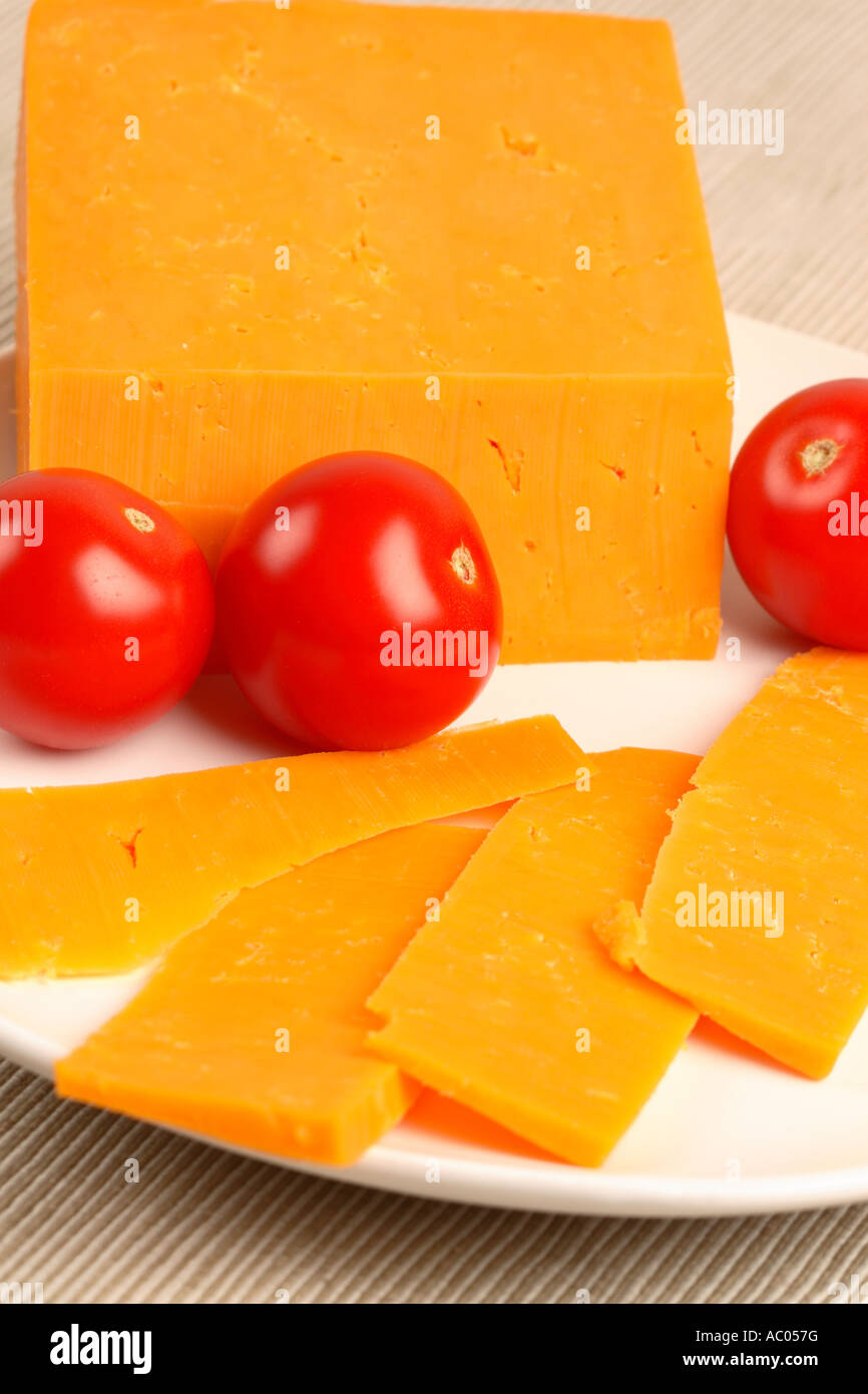 Red Leicester cheese slices and tomato Stock Photo - Alamy