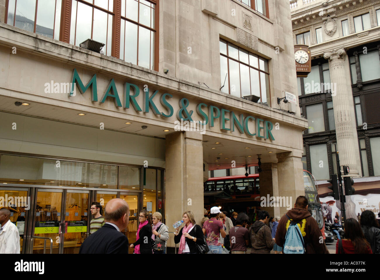 Marks and Spencer store and passing shoppers in Oxford Street London England Stock Photo