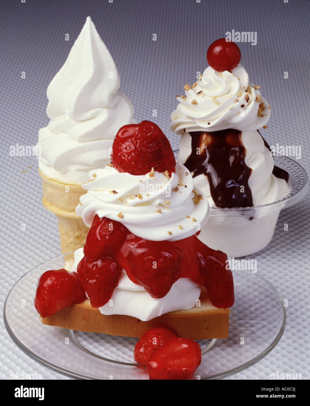 strawberry soft ice cream sundae sunday glass dish whipped cream sprinkle nuts sauce cone