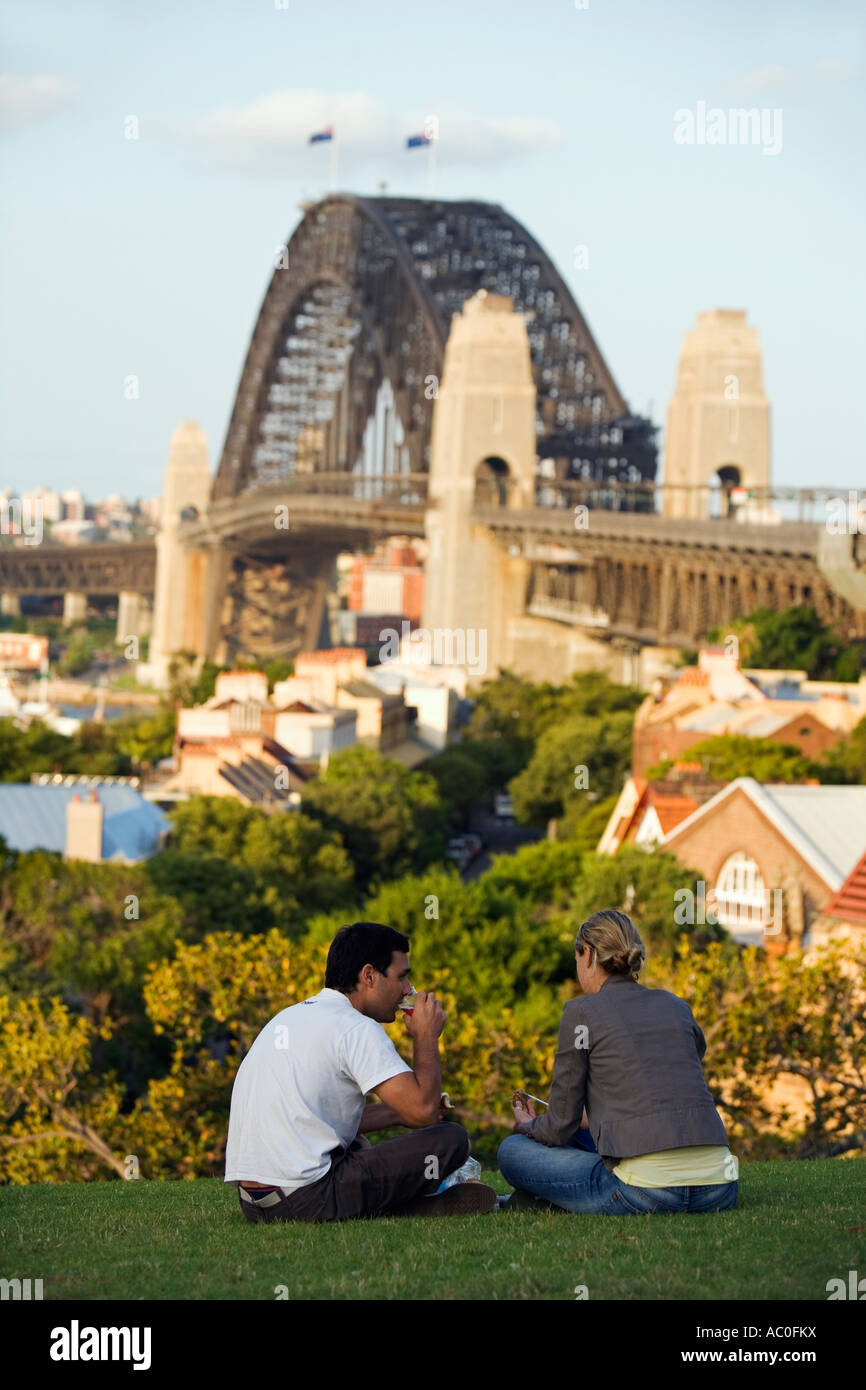 A couple picnic at Observatory Park overlooking Millers Point and the