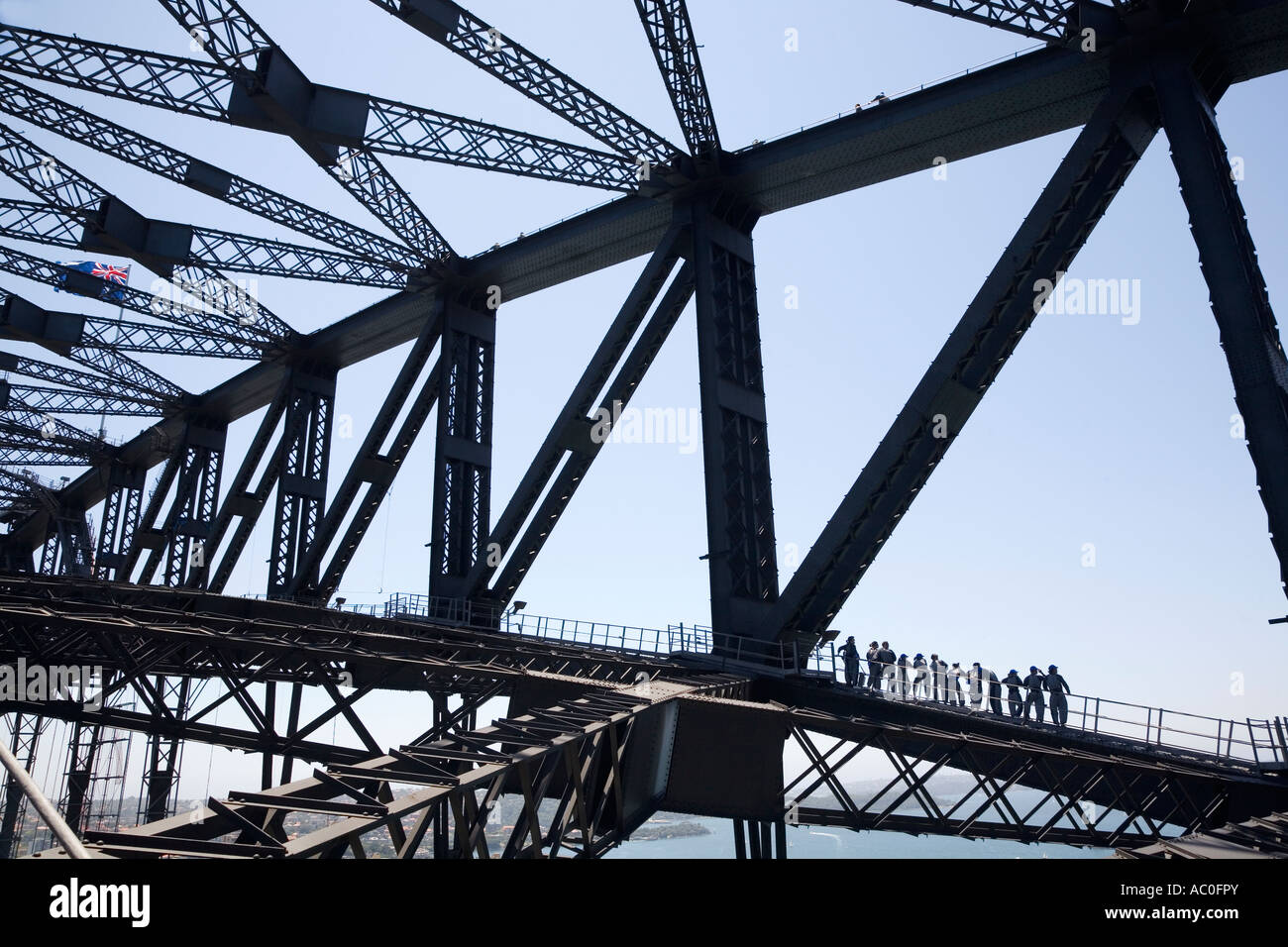 A group of climbers scaling the suspension arch of Sydney Harbour