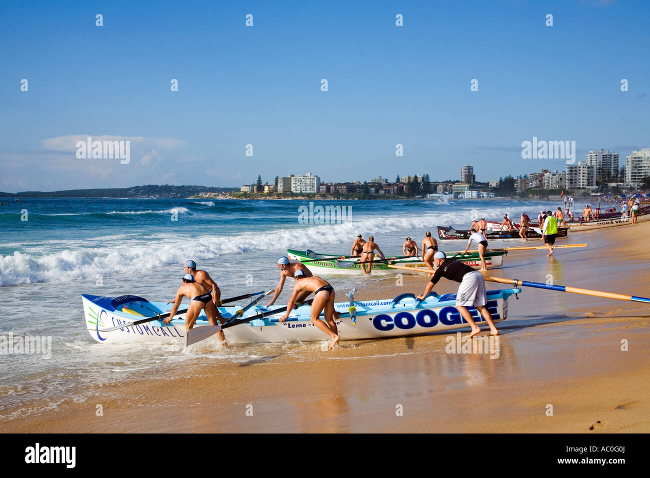 Surfboat teams line up for a race during the New South Wales Surf Lifesaving Championships at Cronulla Beach Stock Photo