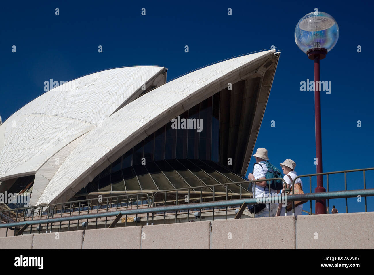 Tourists look at the iconic Sydney Opera House Stock Photo