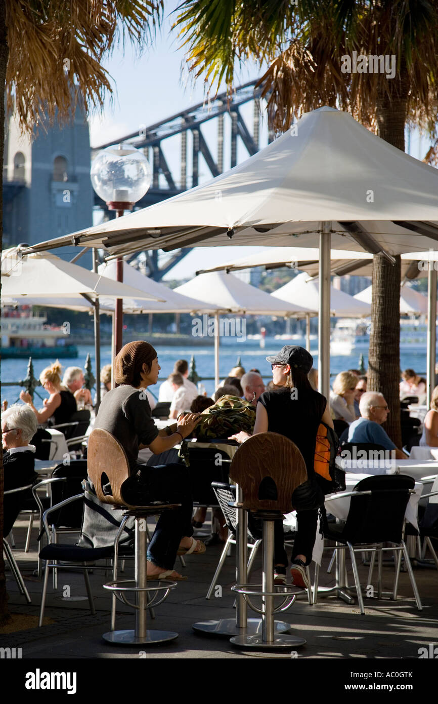 People eat out at the bars and restaurants at Circular Quay Sydney Stock Photo