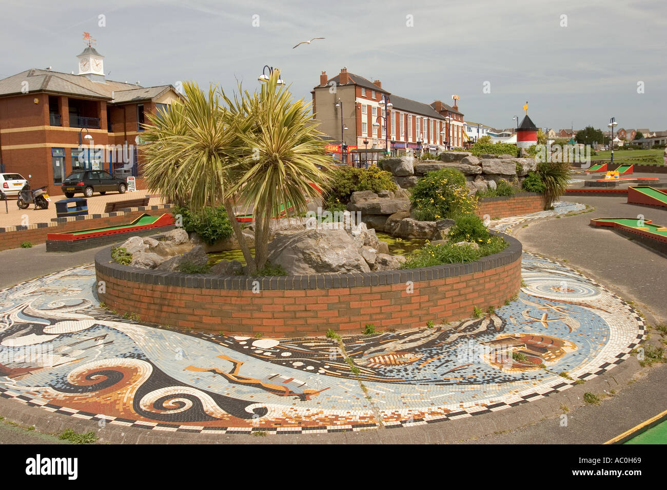 Wales Glamorgan Barry Island planted palm bed and mosaic decoration of seafront miniature golf course Stock Photo