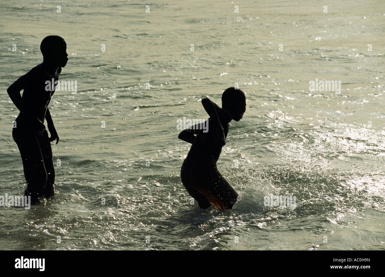 Mauritanian boys play in the surf at Plage des Pecheurs Fishermens