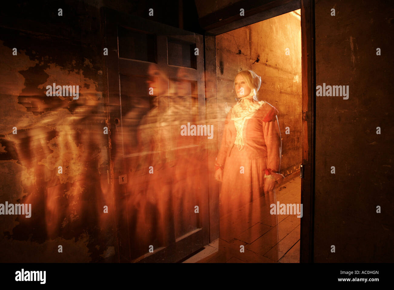 The ghostly figure of a girl standing in a doorway in the Real Mary King's Close, a tourist attraction in Edinburgh, Scotland Stock Photo