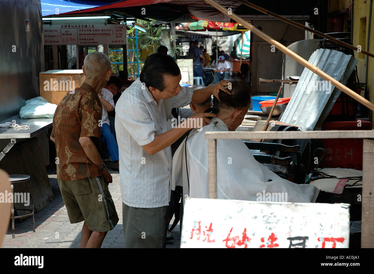 Open air barber shop in Petaling Street Malaysia Stock Photo Alamy