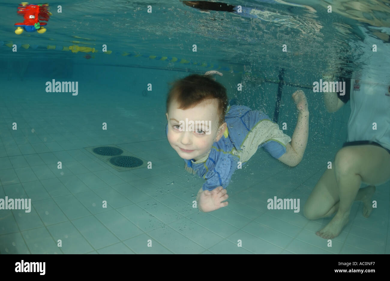 infant swimming underwater in Stock Photo Alamy