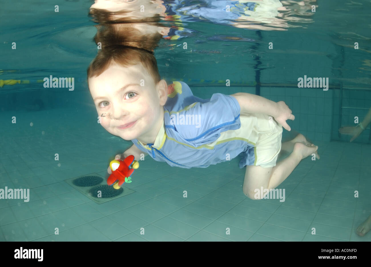 infant swimming underwater in Stock Photo Alamy