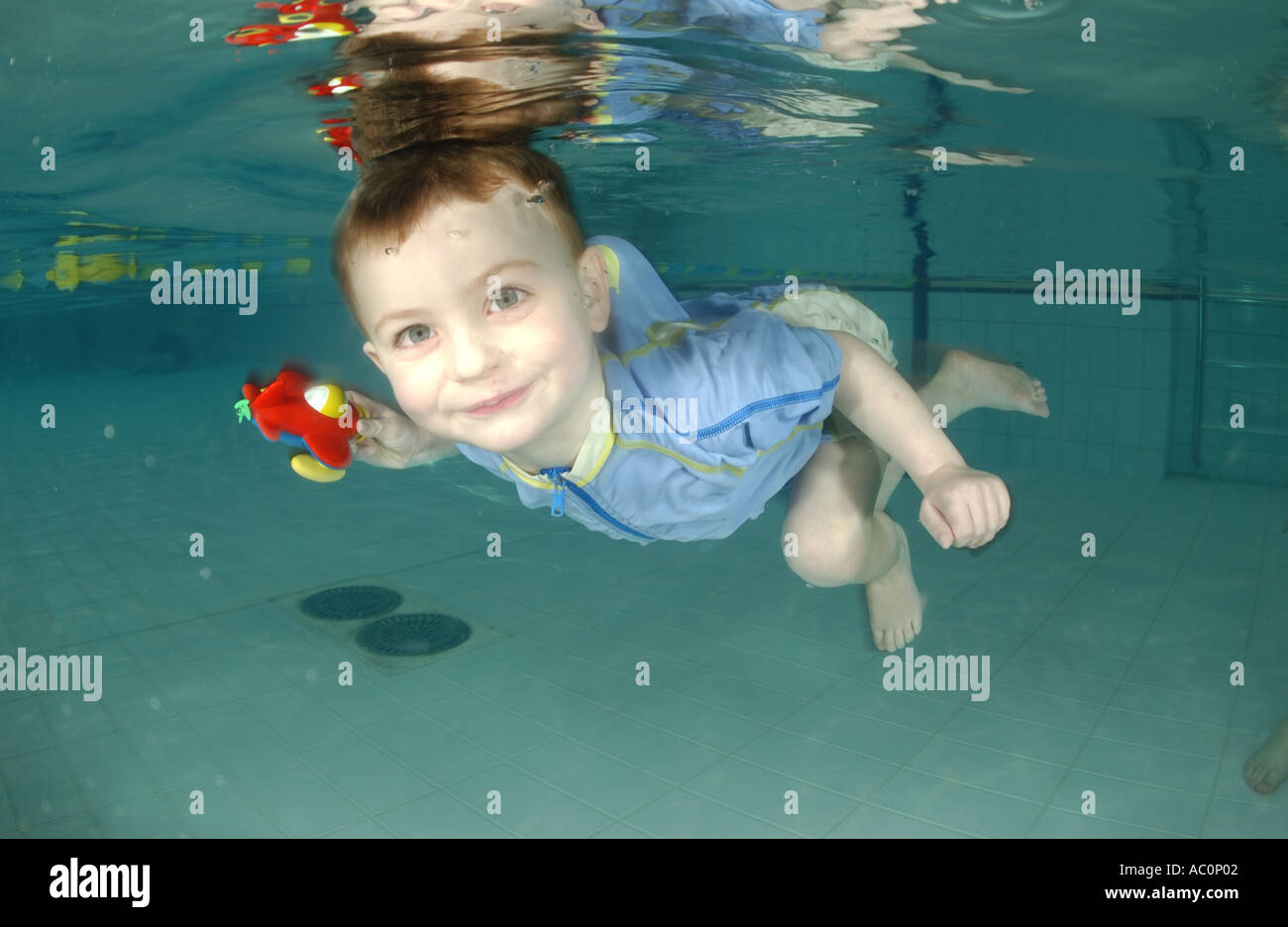 infant swimming underwater in Stock Photo Alamy