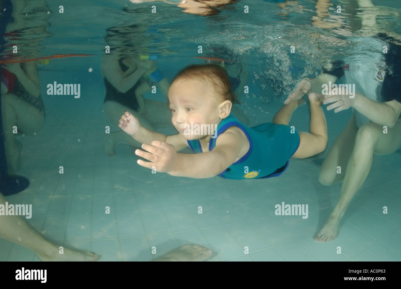infant swimming underwater in Stock Photo Alamy