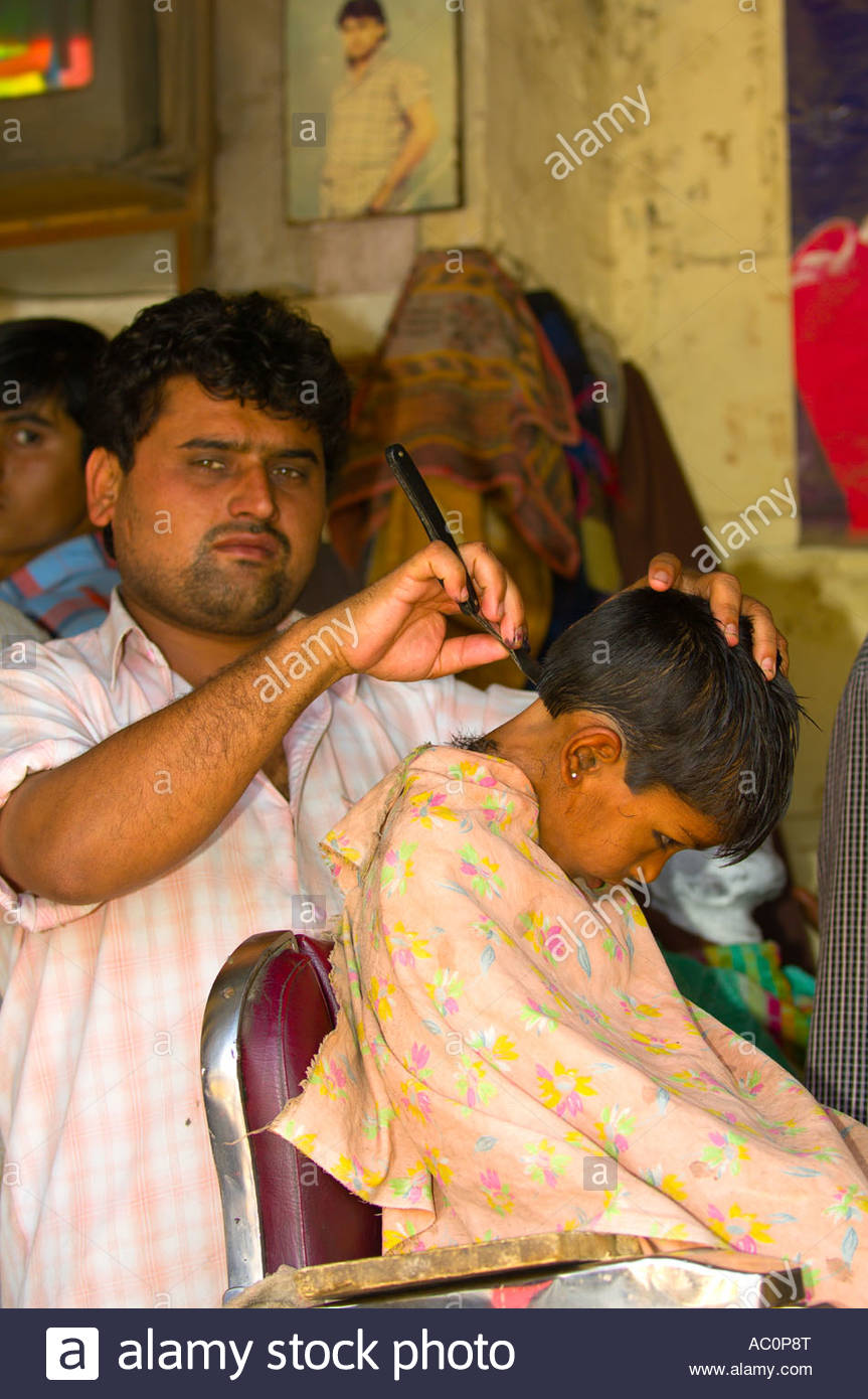 Boy Getting A Haircut In A Barber Shop Jaisalmer Rajasthan India