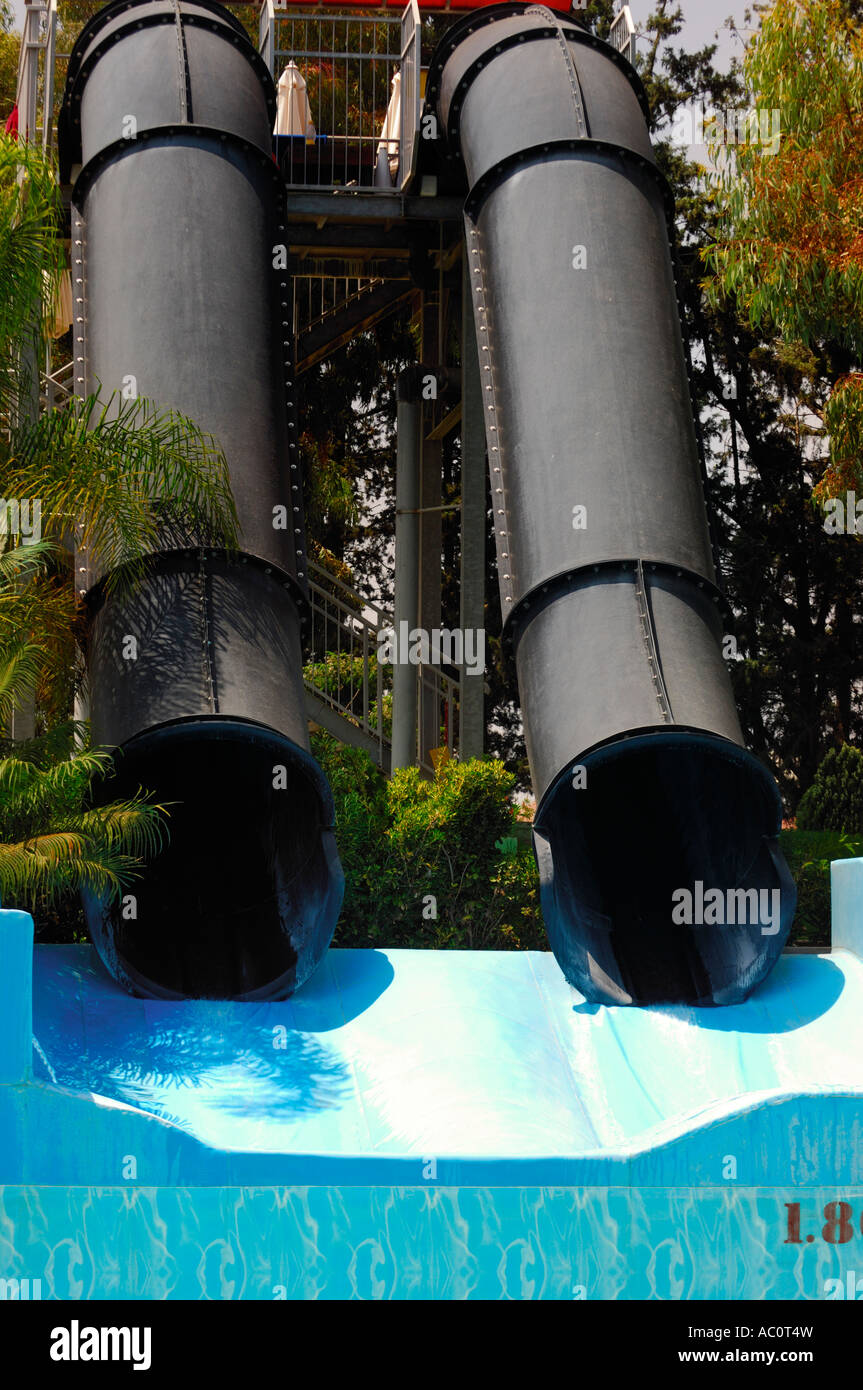 Black Cannons water slide in water park Watermania Fasoury Cyprus Stock Photo