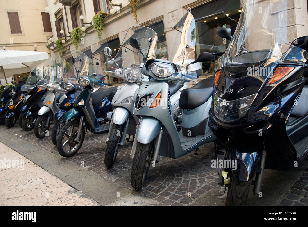 a row of scooters parked in verona Stock Photo Alamy