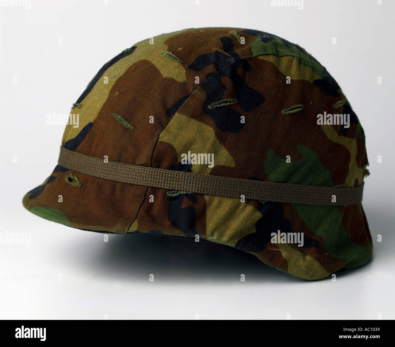 Hat Army Helmet K-Pot camouflaged personal armor head cover safety military hardhat  men women man woman silhouette Stock Photo