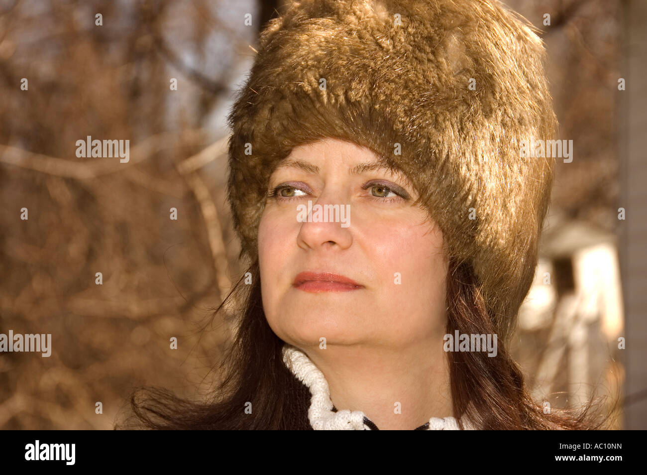 Young woman with a fur hat Stock Photo