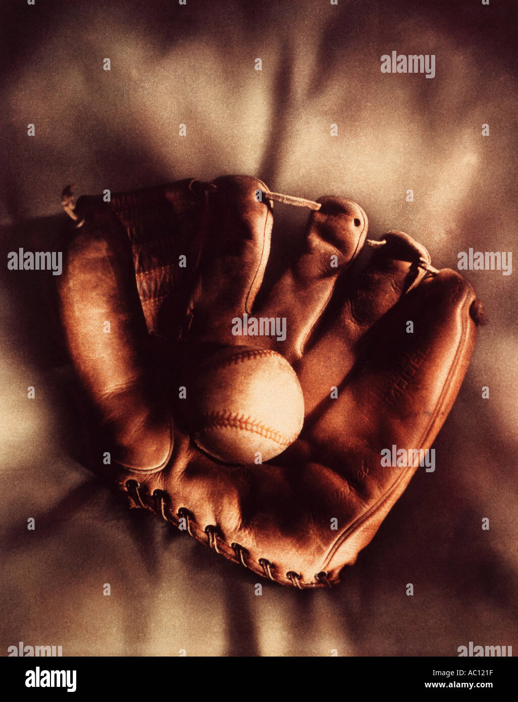 old leather baseball and glove Stock Photo Alamy