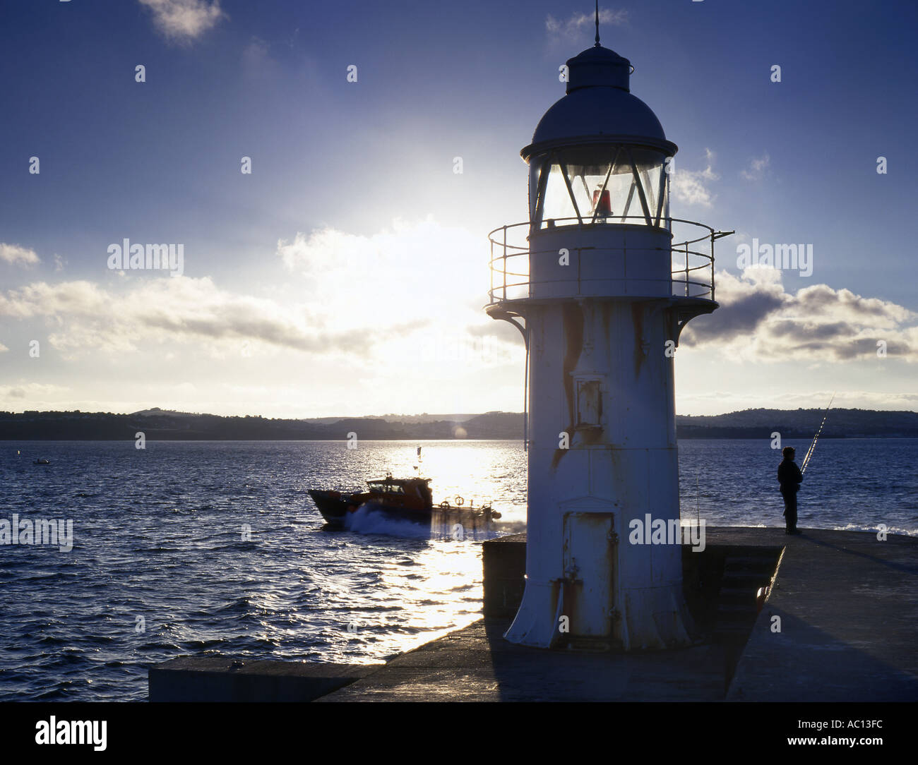 Brixham Harbour Light in Silhouette Stock Photo