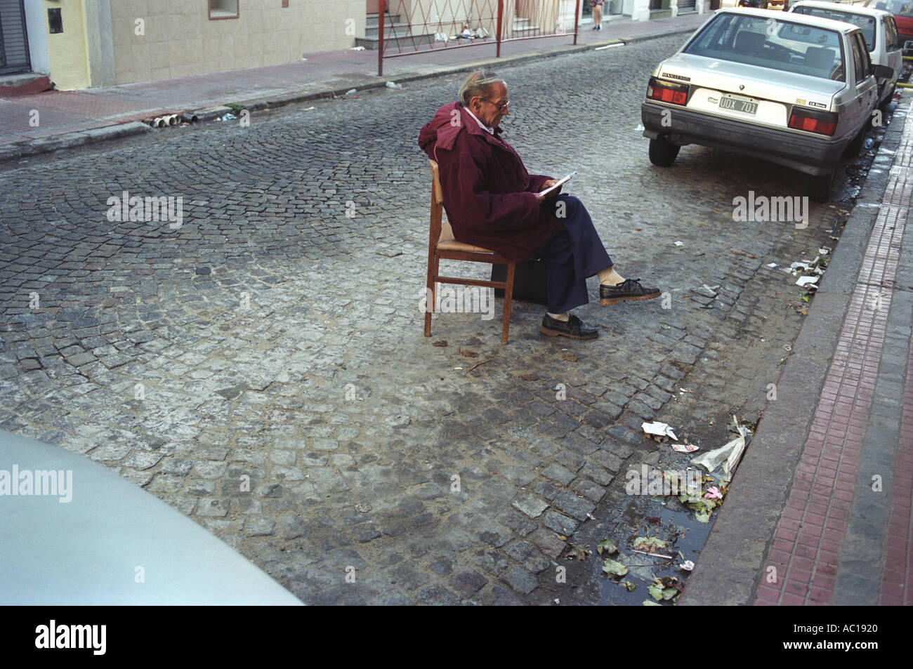 Parking problems a man keeping  a car parking space Buenos Aires Argentina  South America 2000s 2002 HOMER SYKES Stock Photo