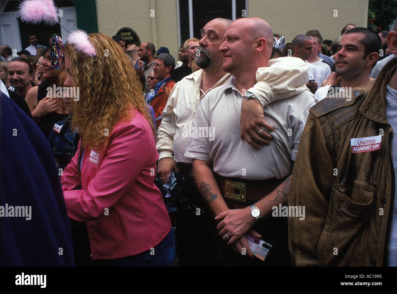 Gay Festival Manchester Pride Festival 1990s UK. Two big men known as 'bears' in crowded street watching parade. LGBT, LGBTQ, 1990s, 90s, 1999. Stock Photo