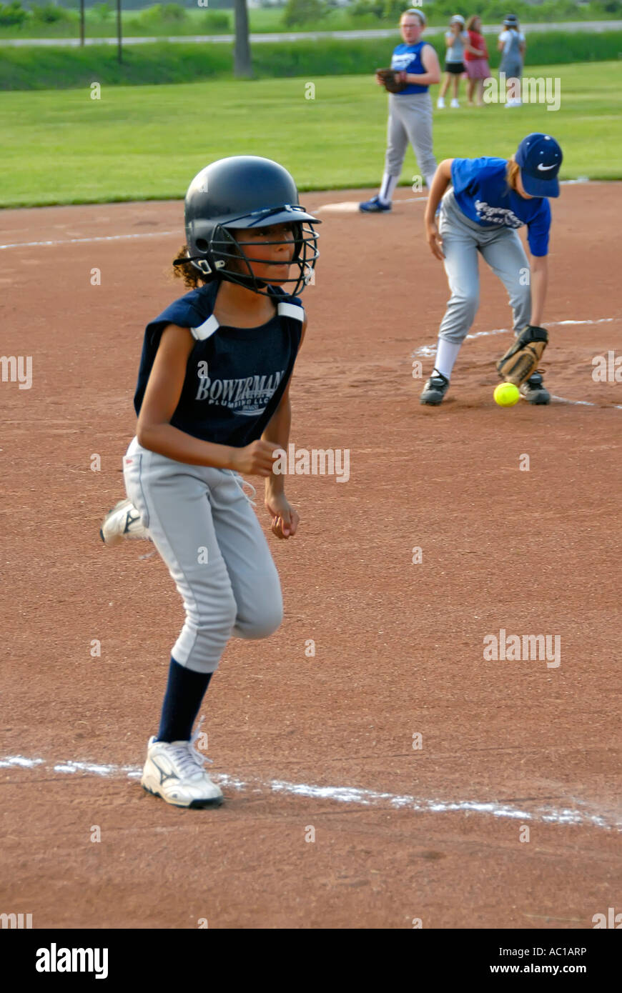 Girl baseball player running Stock Photo Alamy