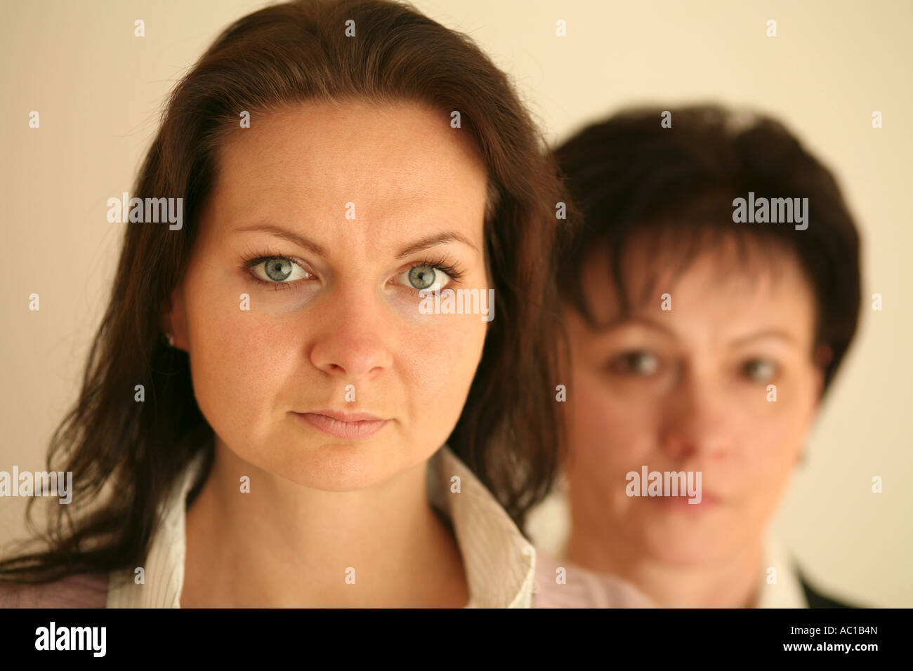Mother and daughter mother in background portrait Stock Photo