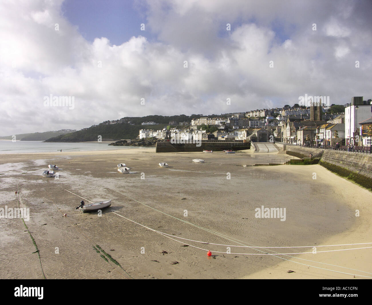 Tide out at St Ives harbour front in the early morning Stock Photo Alamy