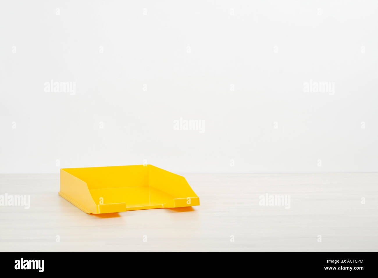 Filing tray on desk yellow close up Stock Photo