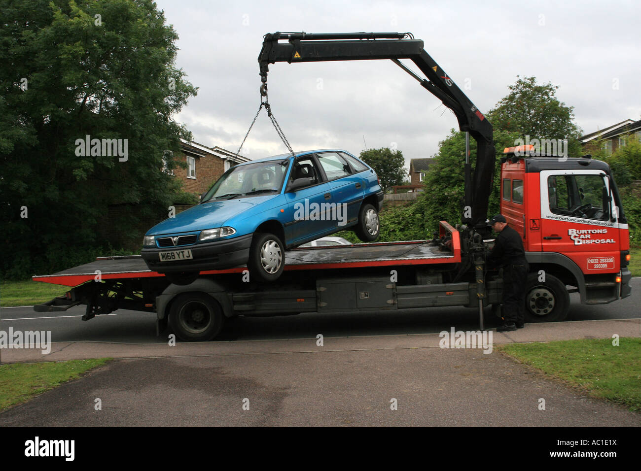 Car lifted by crane onto Scrap Dealers Lorry Stock Photo Alamy