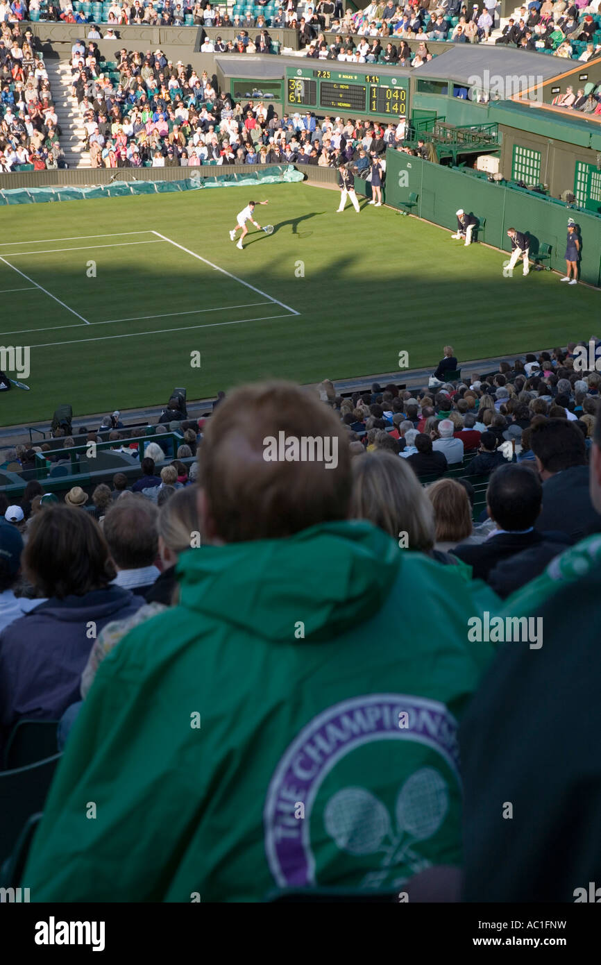 Audience watch play during Carlos Moya Tim Henman game at Centre Court Wimbledon tennis Championship UK Stock Photo