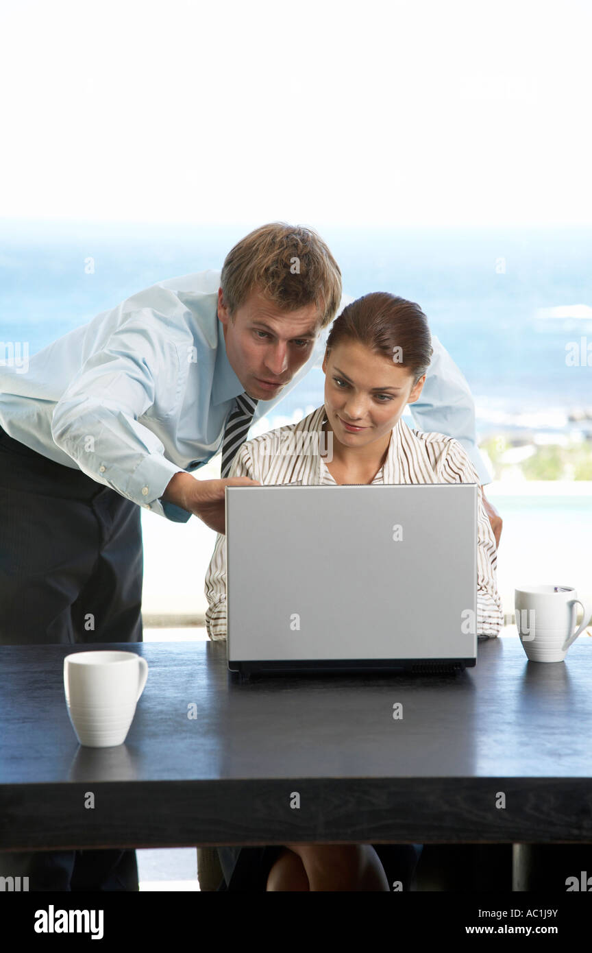 Man and woman working at laptop Stock Photo