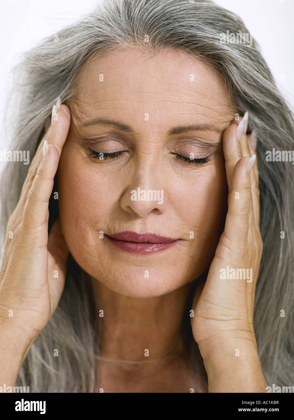 Meditating hands on temples hi-res stock photography and images - Alamy
