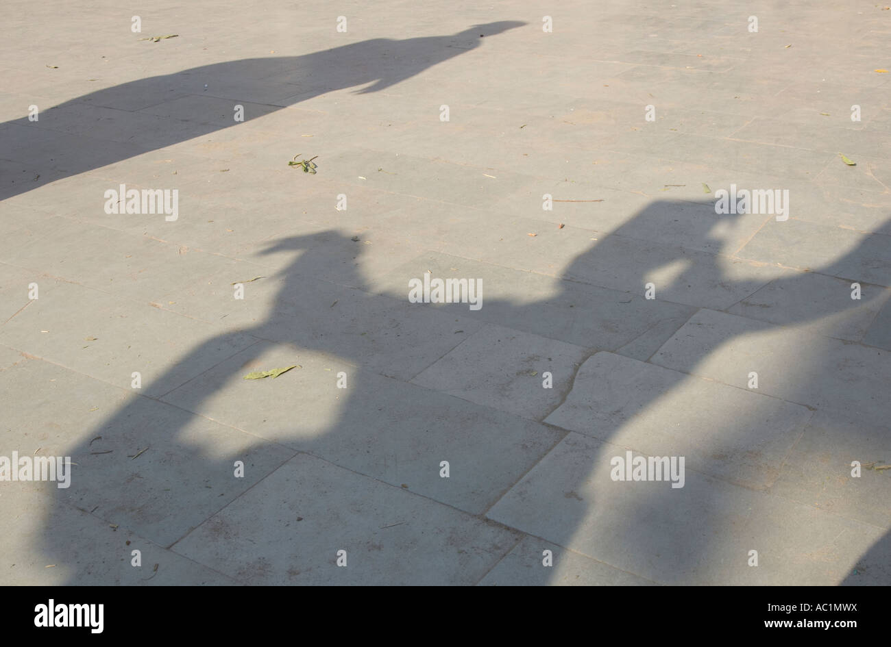 India Himachal Pradesh Kinnaur Baspa Valley Sangla Ataro local religious festival in Baring Narj temple shadow of a man wearing Stock Photo