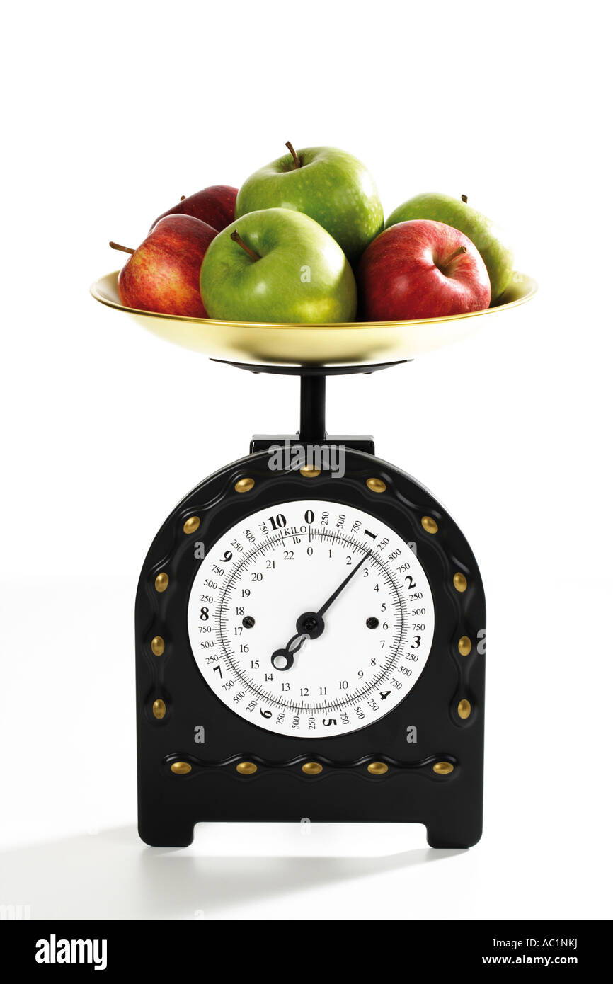 Two apples on a digital kitchen scale - Stock Image - H305/0140 - Science  Photo Library