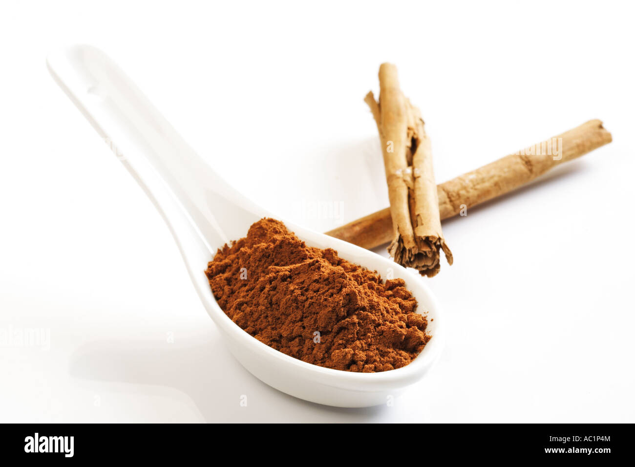 Cinnamon powder and cinnamon sticks Stock Photo