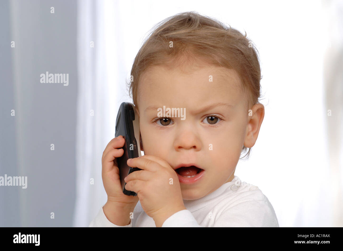 Little child using mobile phone, close-up Stock Photo