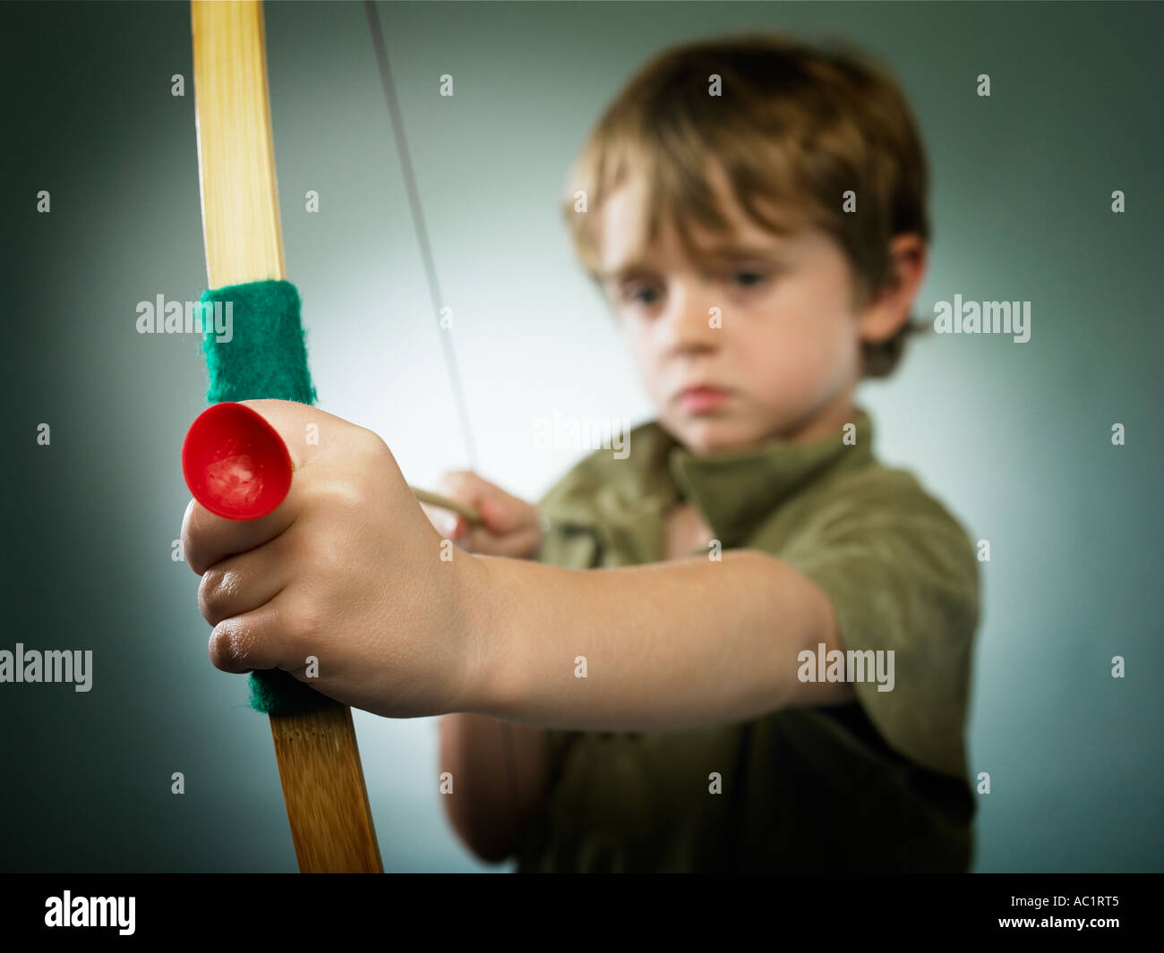 Boy Dressed As Robin Hood With To Bow And Arrow Stock Photo Alamy