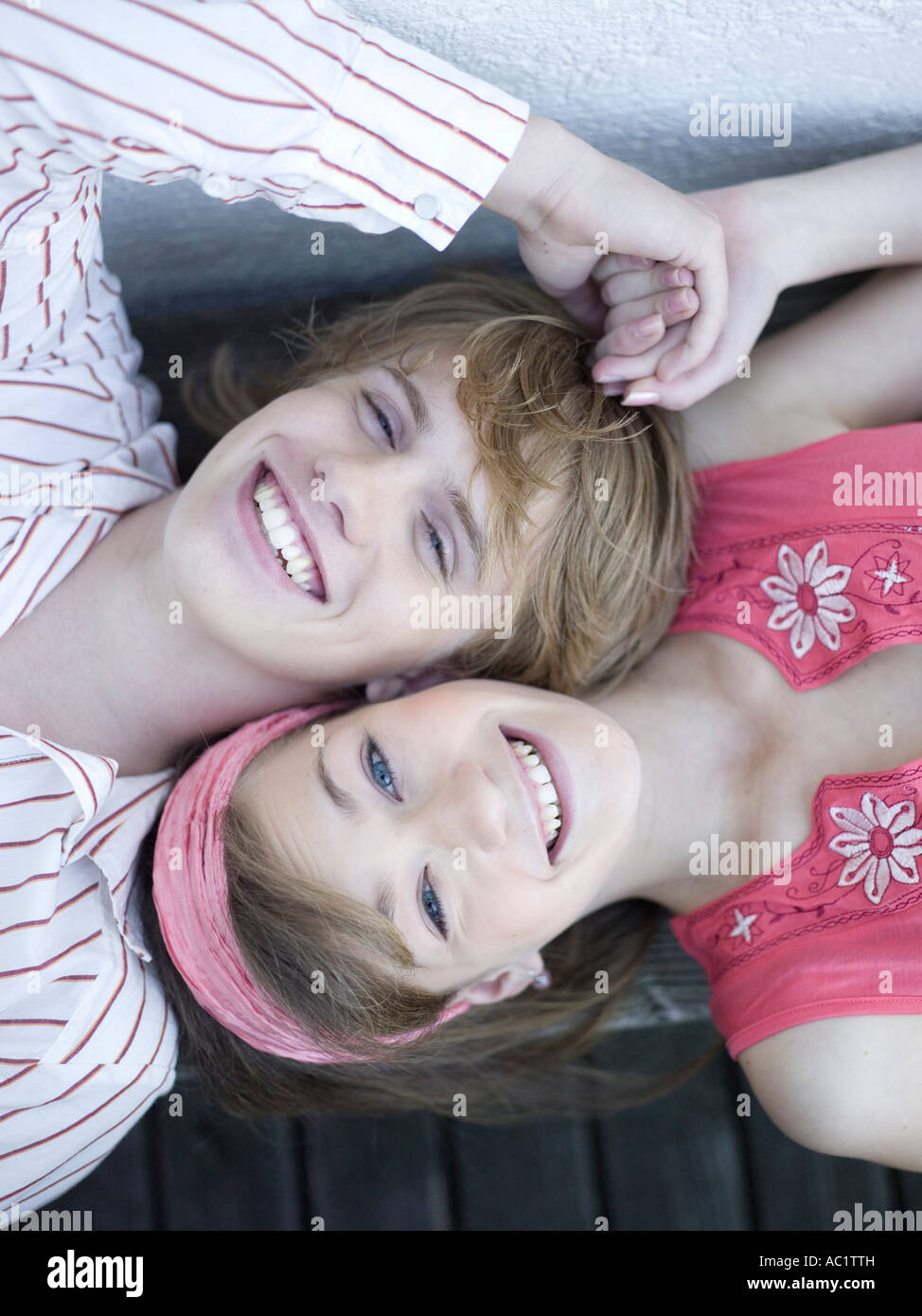 Two teen boys holding hands hi-res stock photography and images - Alamy