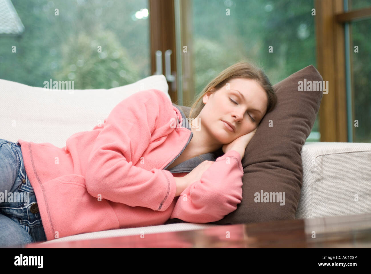 Woman sleeping on sofa Stock Photo Alamy