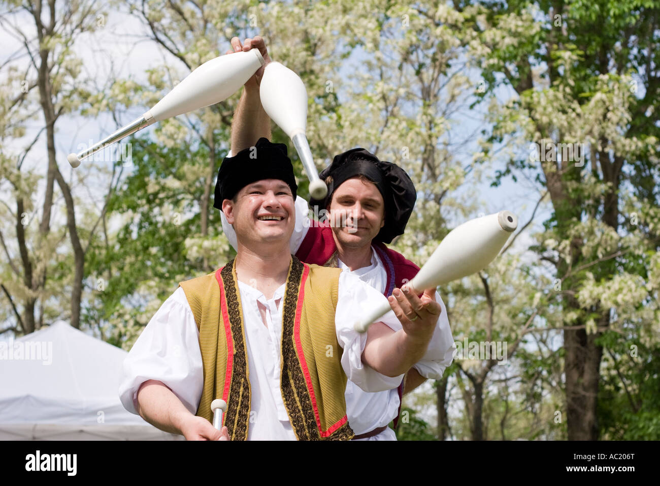 Two men juggle at a renaissance festival in Nebraska. Stock Photo