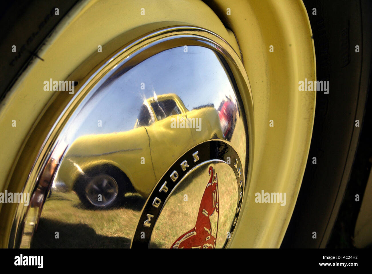 REFLECTION OF CAR IN HUB CAP OFF OLD GMH HOLDEN CAR HORIZONTAL