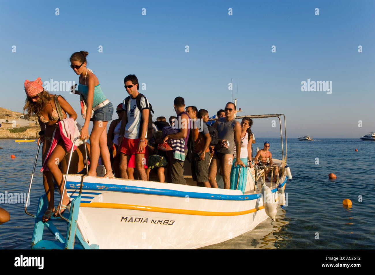 People leaving boat at beach Paradise Beach Mykonos Greece Stock Photo