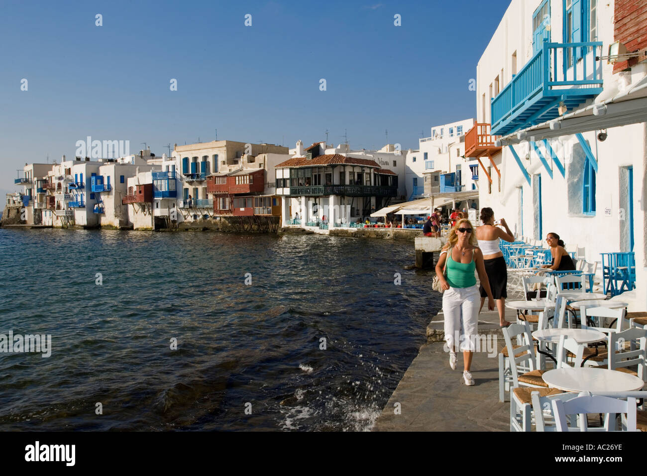 View along street with restaurants and bars Little Venice Mykonos Town Mykonos Greece Stock Photo