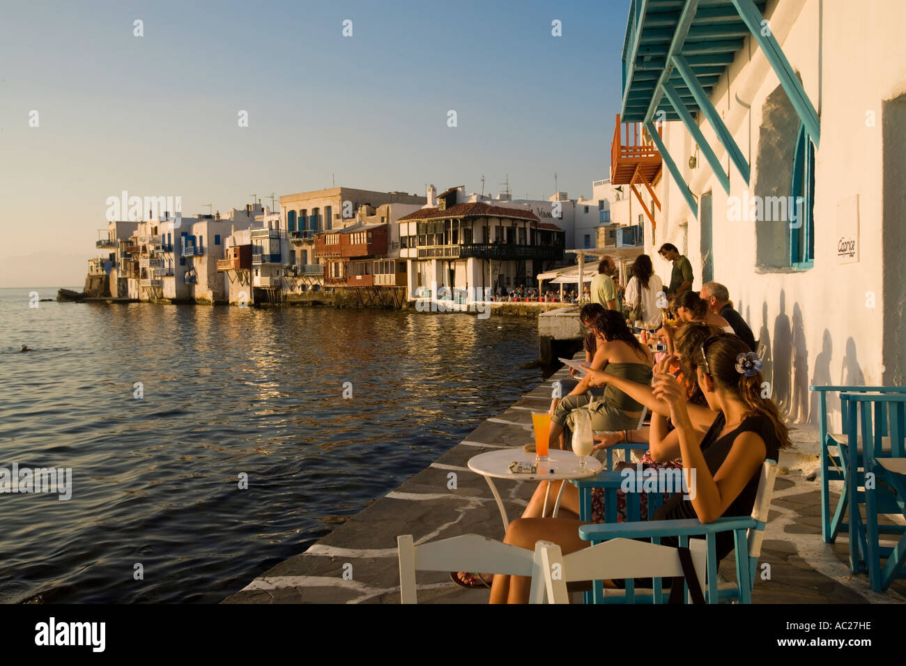 People sitting in the Caprice Bar directly at sea Little Venice Mykonos  Town Mykonos Greece Stock Photo - Alamy