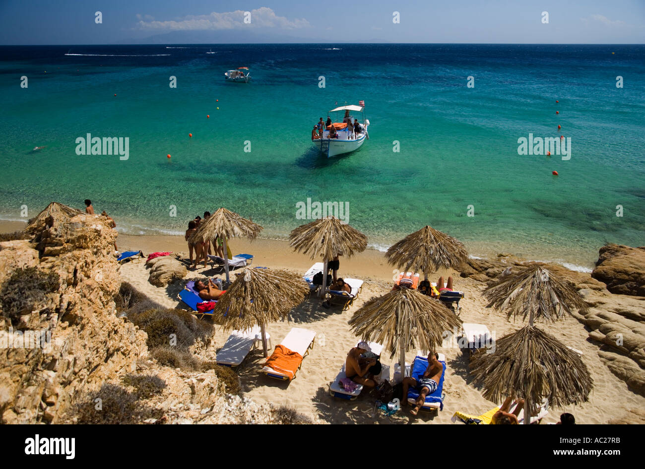 Boat with tourists arriving at bank of the Elia Beach Elia Mykonos Greece Stock Photo