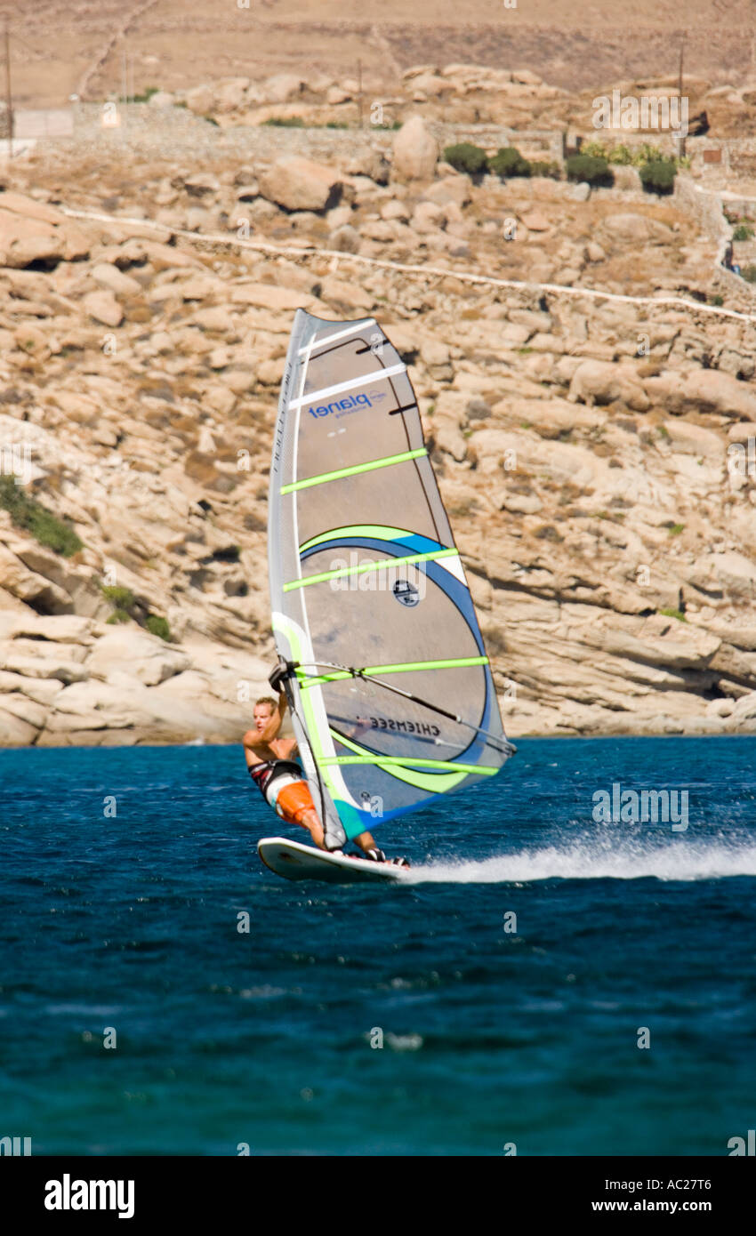 Surfer in action at Kalafati Beach Kalafati Mykonos Greece Stock Photo