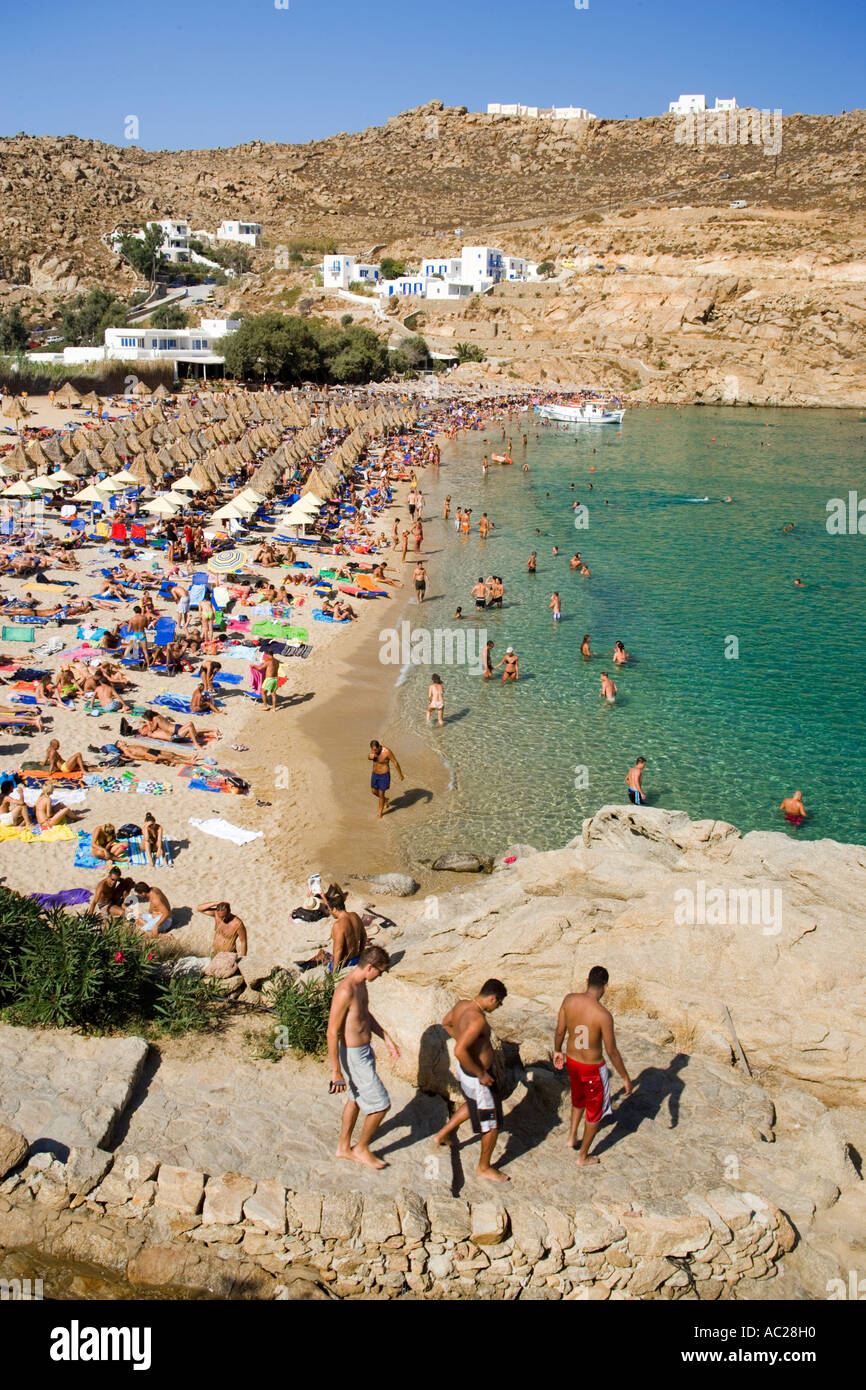 People bathing at Super Paradise Beach knowing as a centrum of gays and nudism Psarou Mykonos Greece Stock Photo