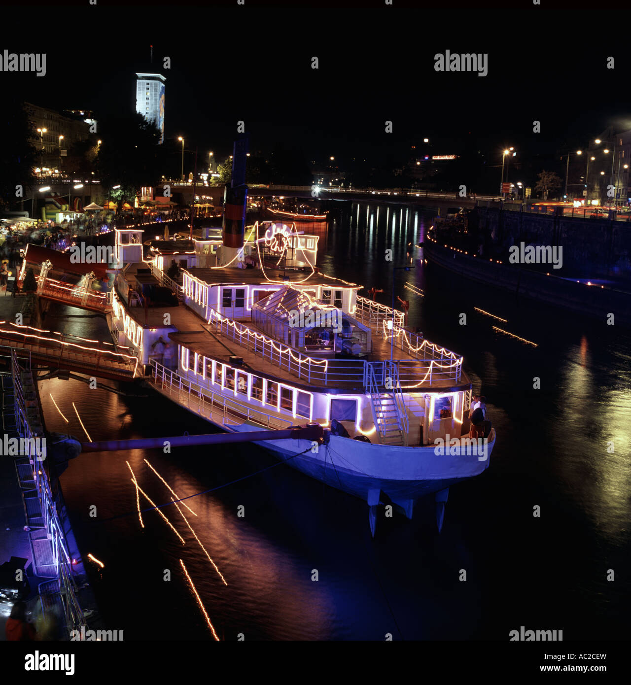 Boats on the Danube Canal by night, Vienna, Austria Stock Photo