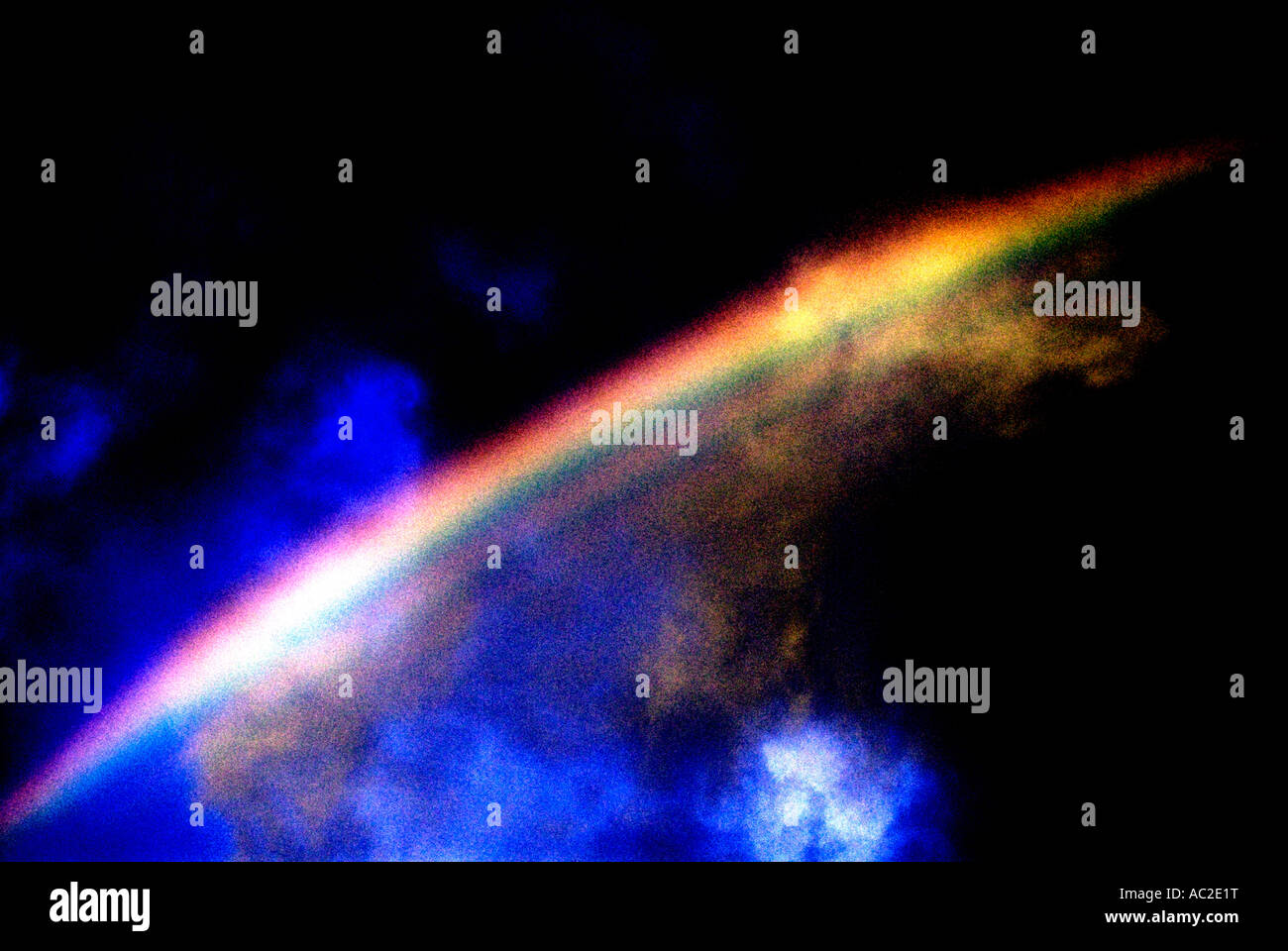Rainbow over dark and stormy sky Stock Photo - Alamy